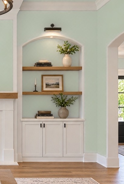 Close view of painted wall, arched trim and built-in cabinetry